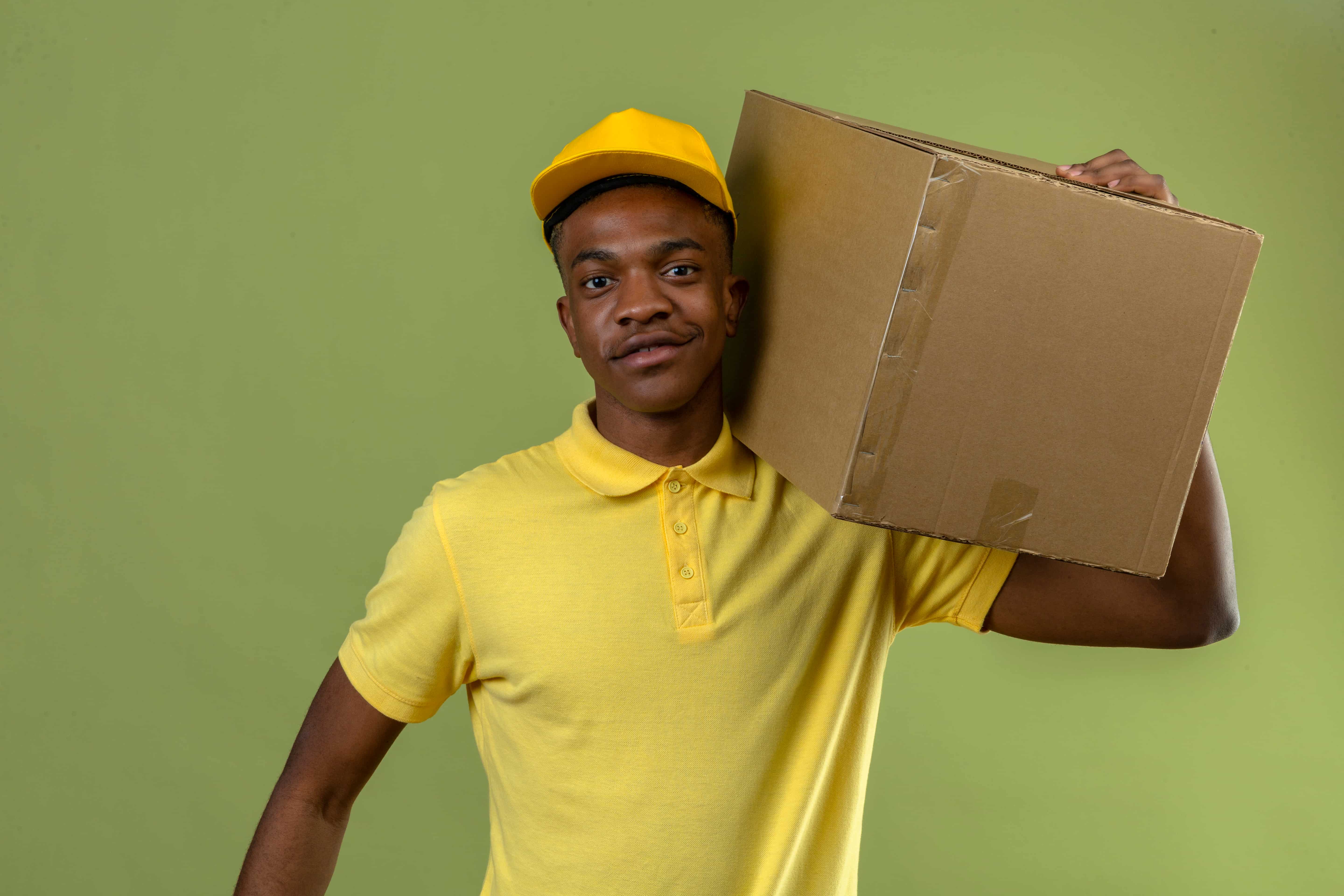 African delivery agent on bike delivering parcel